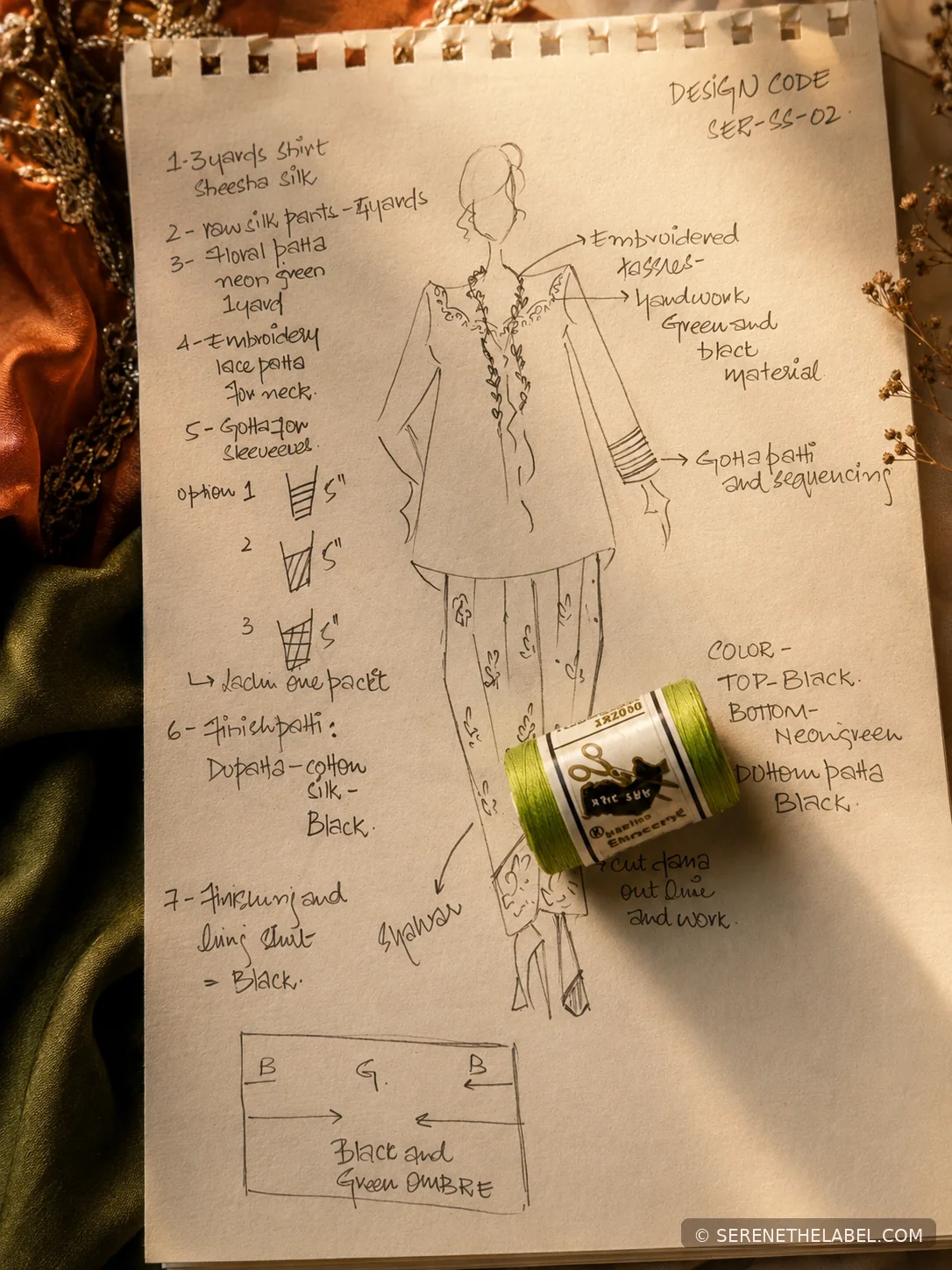 Serene garment sketch with green thread spool and handwritten construction notes